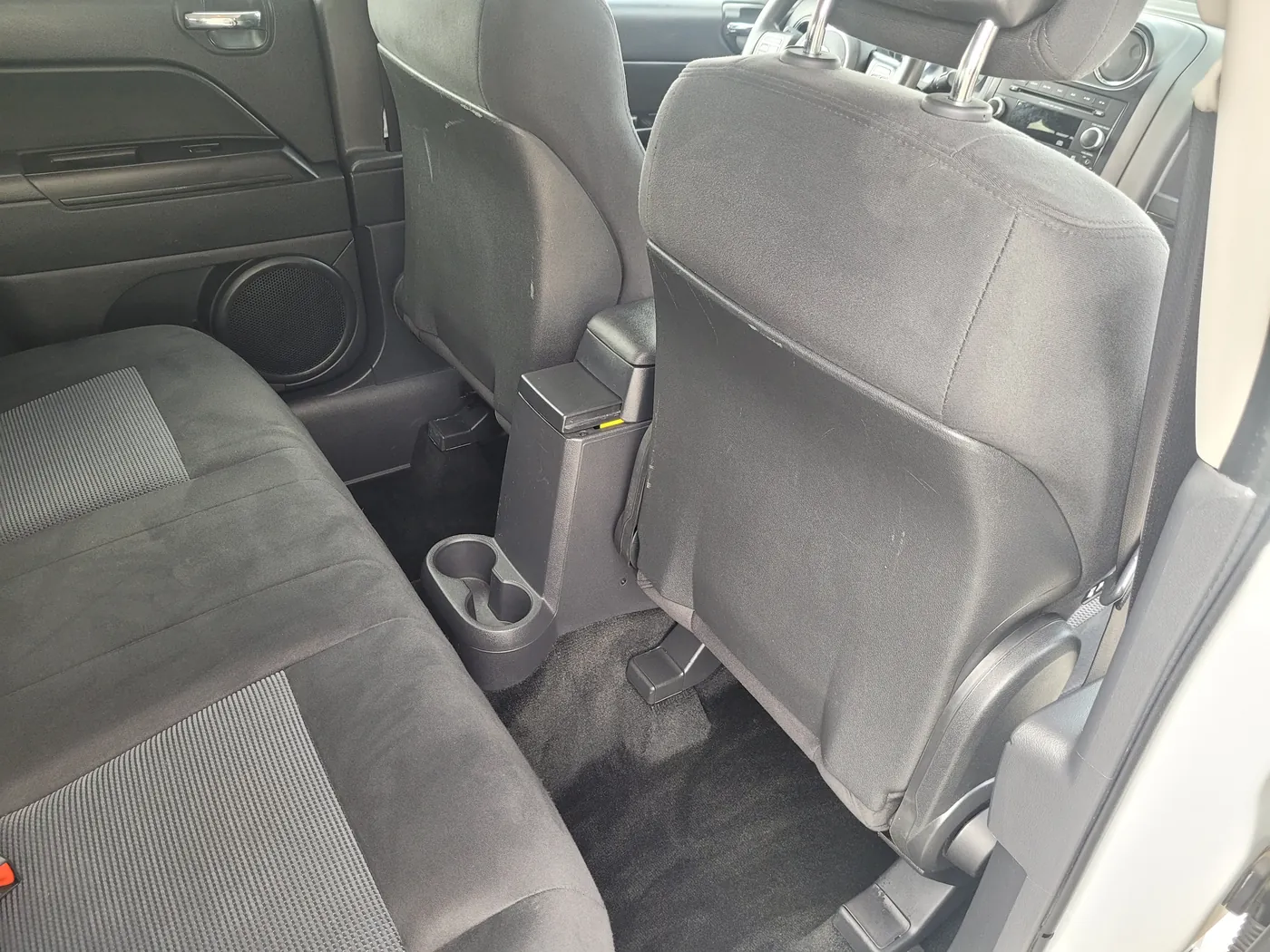 The same footwell shampooed and hot-water extracted, carpet clean
