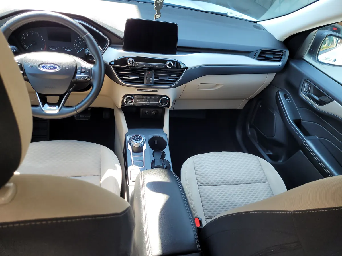 A restored car interior with clean carpets and conditioned leather